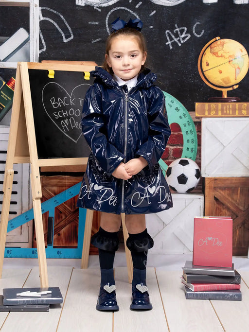 Smiling girl modelling the A Dee blair raincoat.