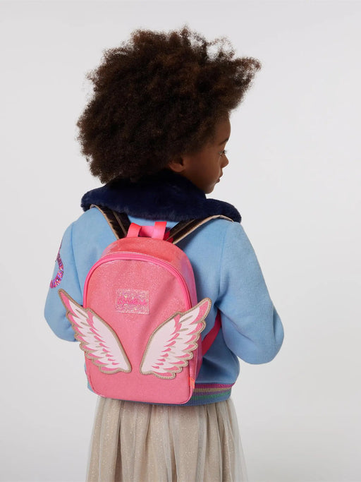 Girl modelling the Billieblush wing backpack.