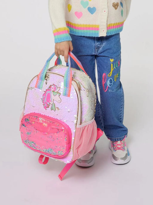 Girl modelling the Billieblush sequin backpack.