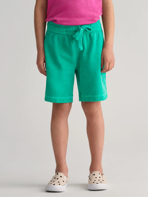 Boy modelling the GANT sunfaded track shorts.