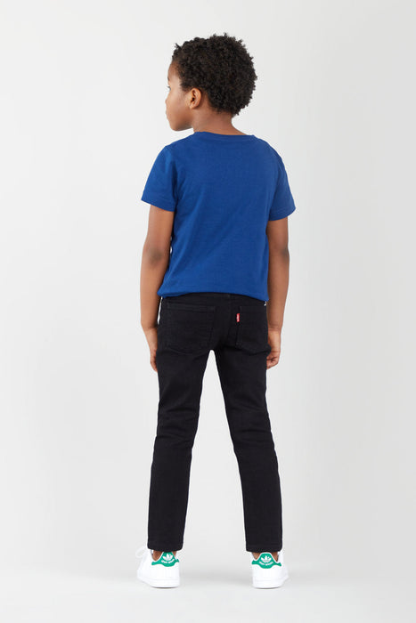 Boy modelling the black Levi's 510 skinny fit jeans.