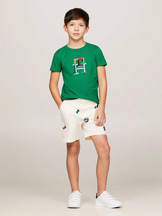 Boy modelling the Tommy Hilfiger monogram t-shirt.
