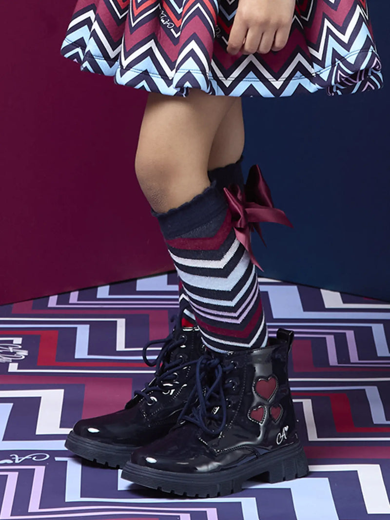 A Dee alessandra knee socks, modelled by girl.