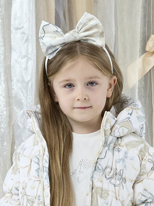 Smiling Girl modelling the A Dee allie headband.