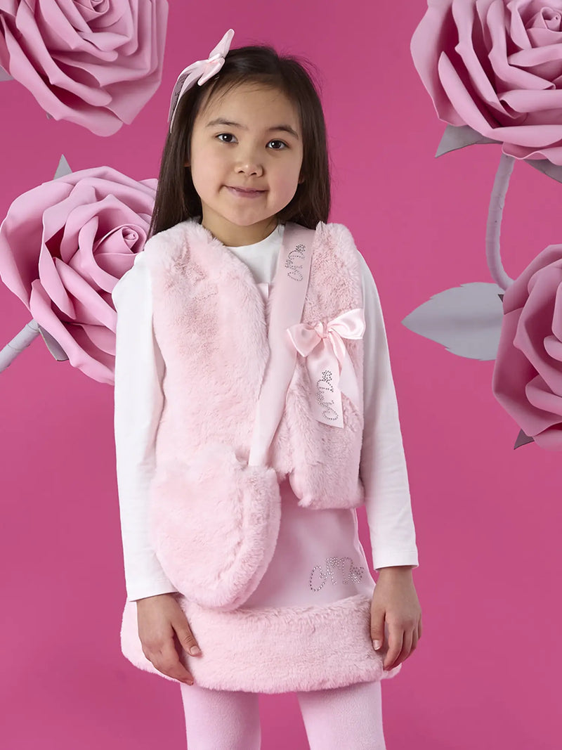 Girl modelling the A Dee alma heart bag.