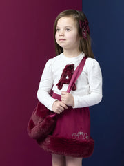 Girl modelling the A Dee alma heart bag.