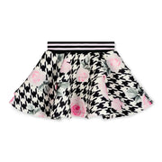 Girl's bold houndtooth patterned skirt.
