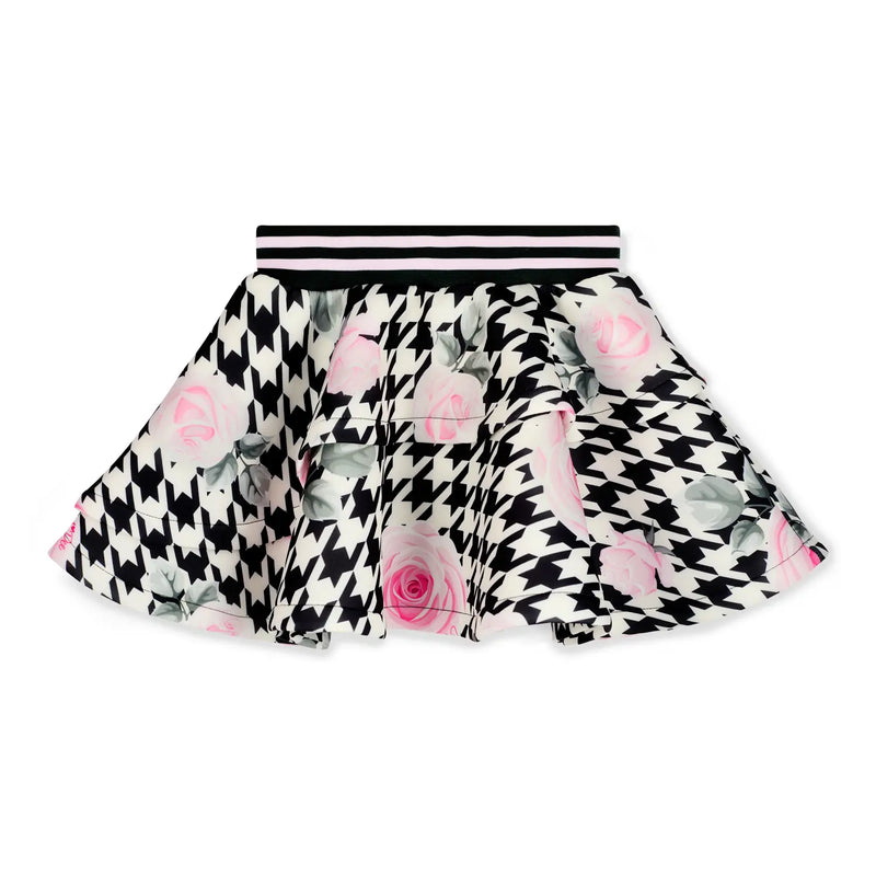 Girl's bold houndtooth patterned skirt.