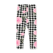 Girl's bold houndtooth patterned leggings.