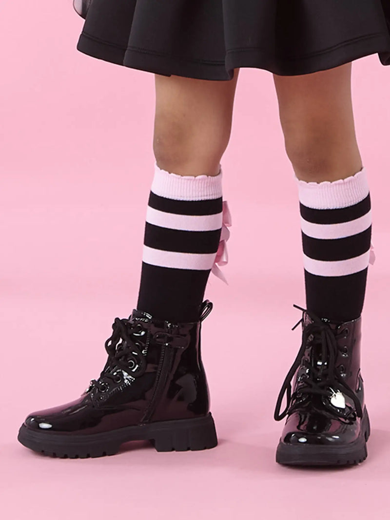 Girl modelling the A Dee astrid knee socks.