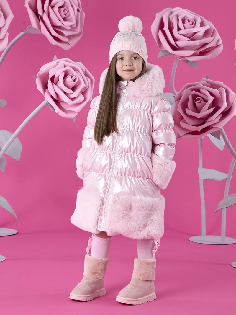 Girl wearing the A Dee aurora puffer jacket.