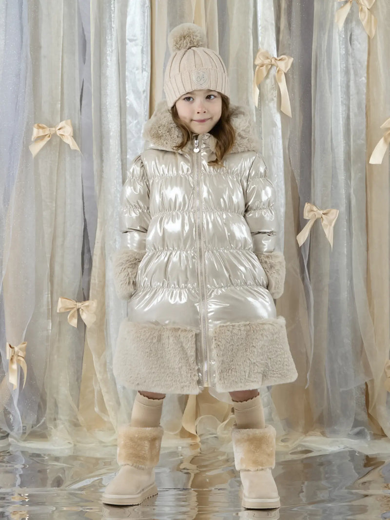 Girl wearing the A Dee aurora puffer jacket.