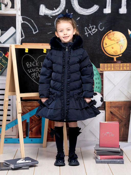 Smiling girl modelling the A Dee becky coat.