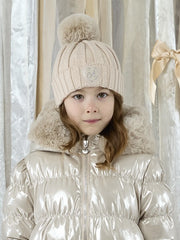 A Dee burgundy bobbie bobble hat, modelled by girl.