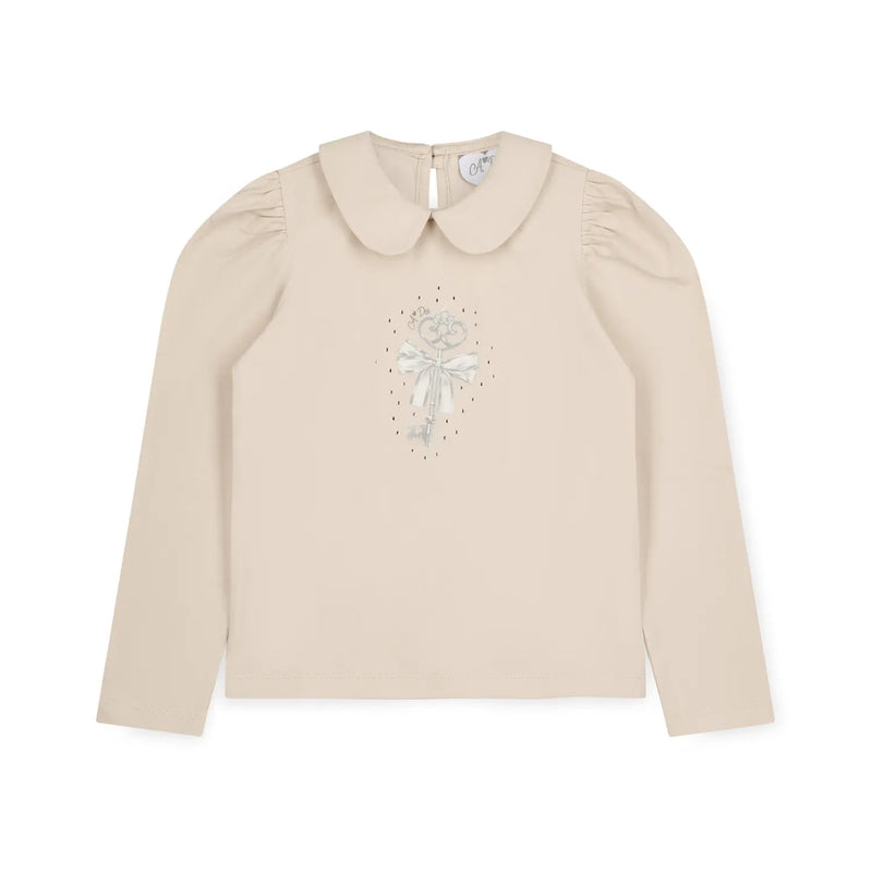 A Dee girl's beige long sleeve top.