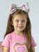 Smiling girl modelling the A Dee emily headband.