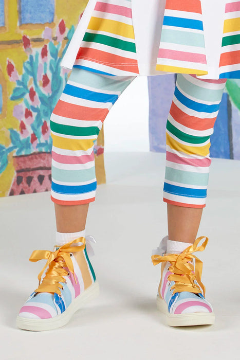 Girl modelling the A Dee striped jazzy high top sneakers.