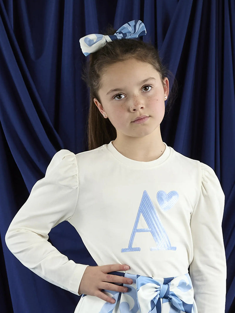 A Dee leighton hair bow, modelled by girl.