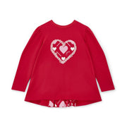 Girl's bright red top.