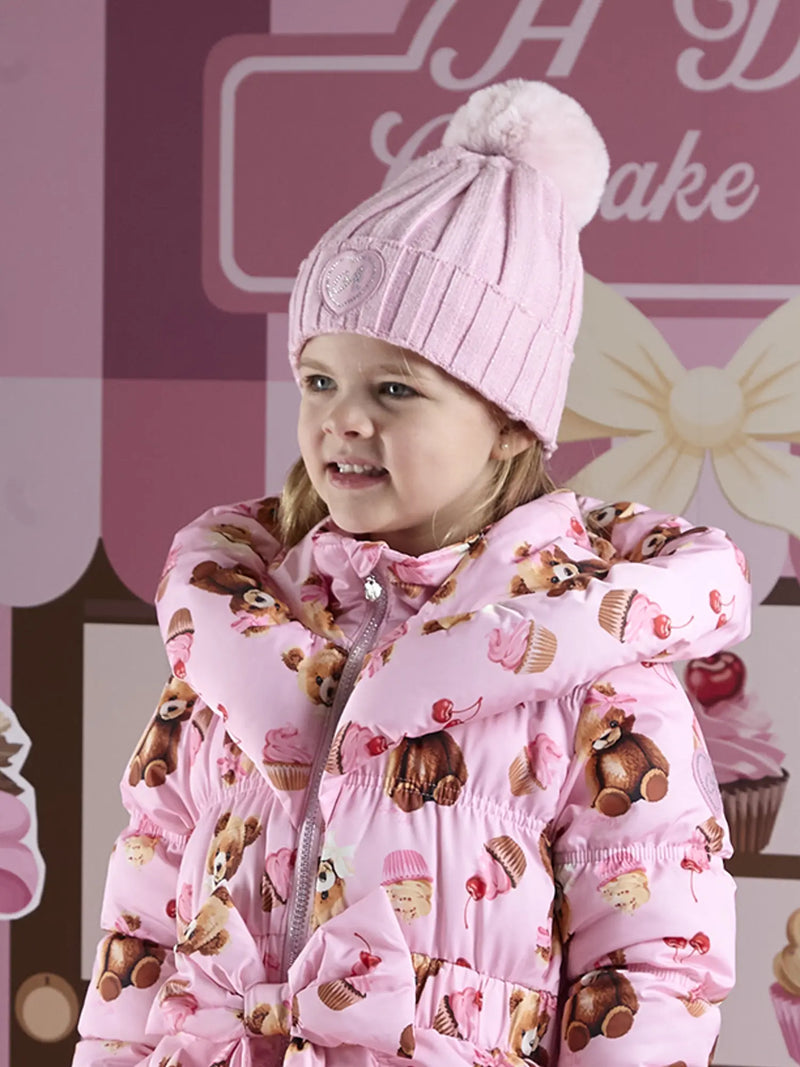 Girl in pink mallory bobble hat by A Dee.