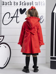 Red A Dee raincoat with large bow on the back.