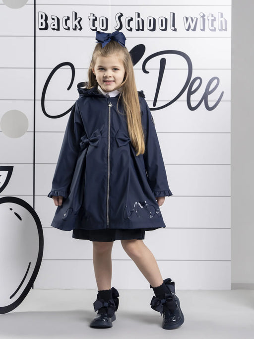 Smiling Girl modelling the A Dee nova raincoat.