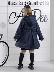 Closer look at the A Dee nova raincoat showing detail of the large bow on the back.