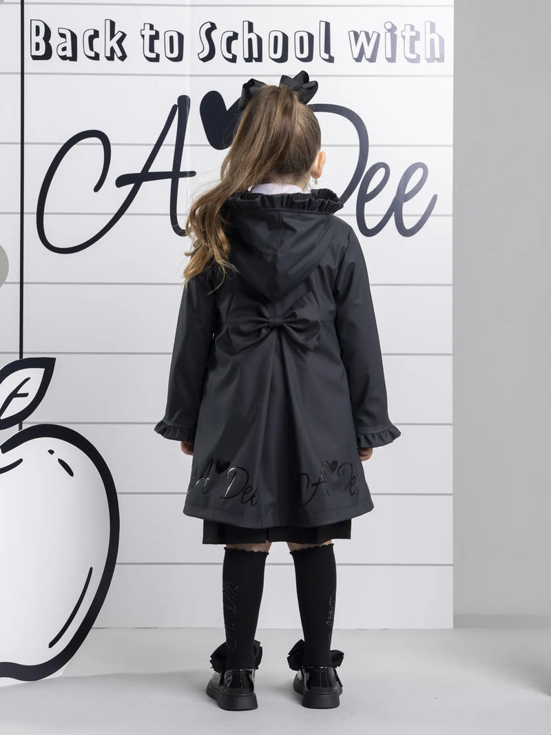 Closer look at the A Dee nova raincoat showing detail of the large bow on the back.