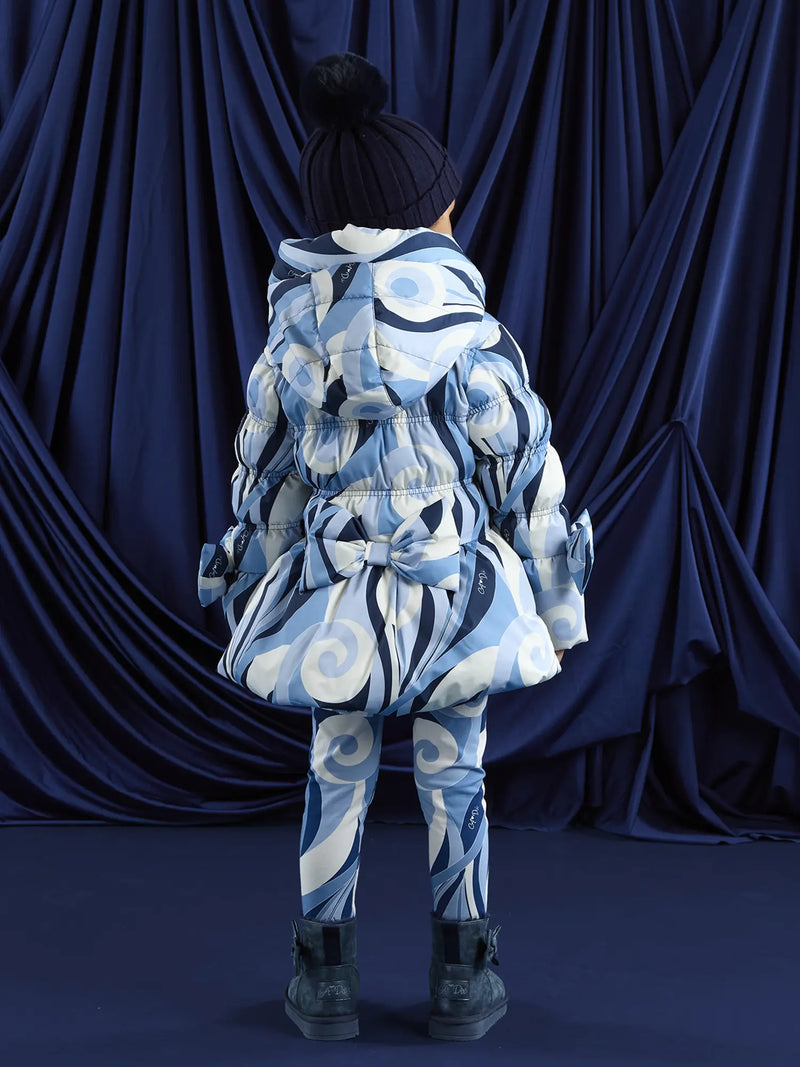 A Dee blue coat with large bow on the back.