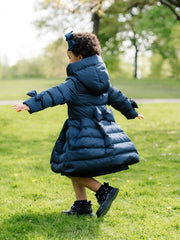A Dee padded jacket with bow on the back.