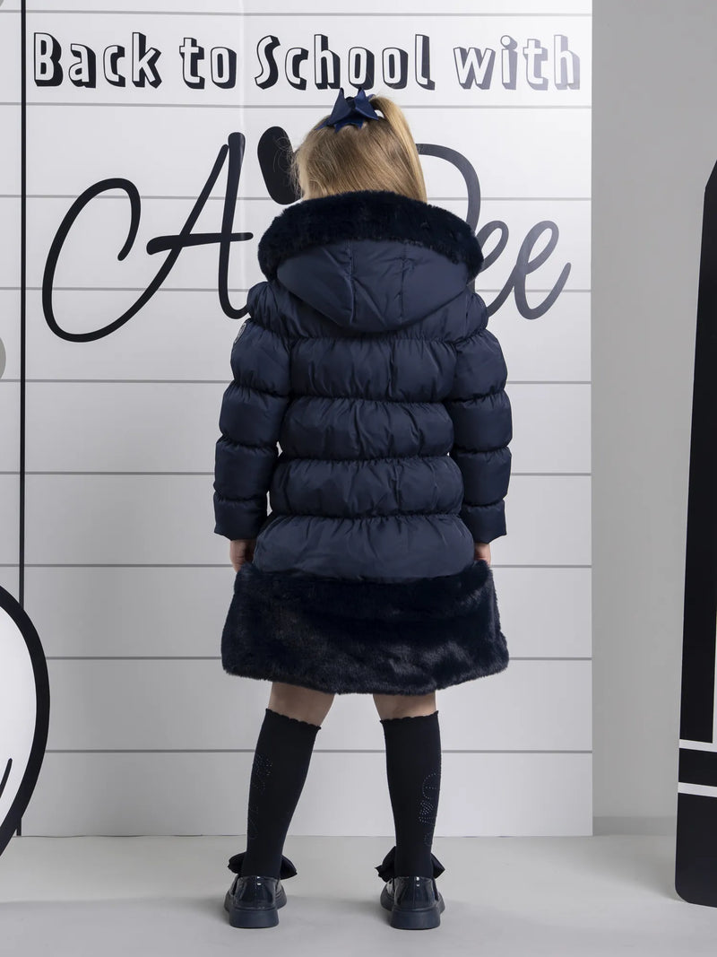 A Dee rhea coat with navy faux fur trim.