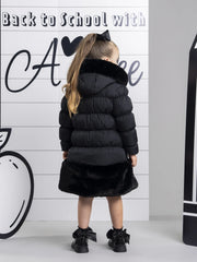 A Dee rhea coat with black faux fur trim.