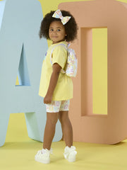 Back of the A Dee yellow saz shorts set.