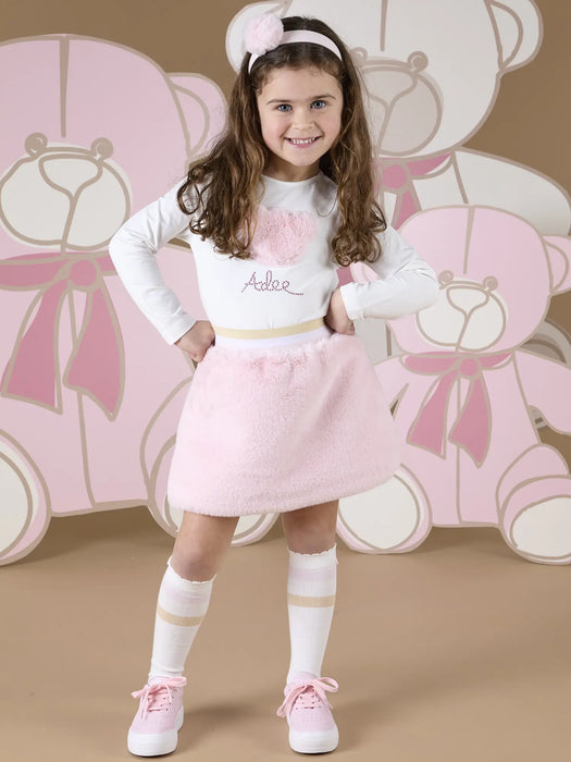 Smiling girl modelling the A Dee sisi skirt set.