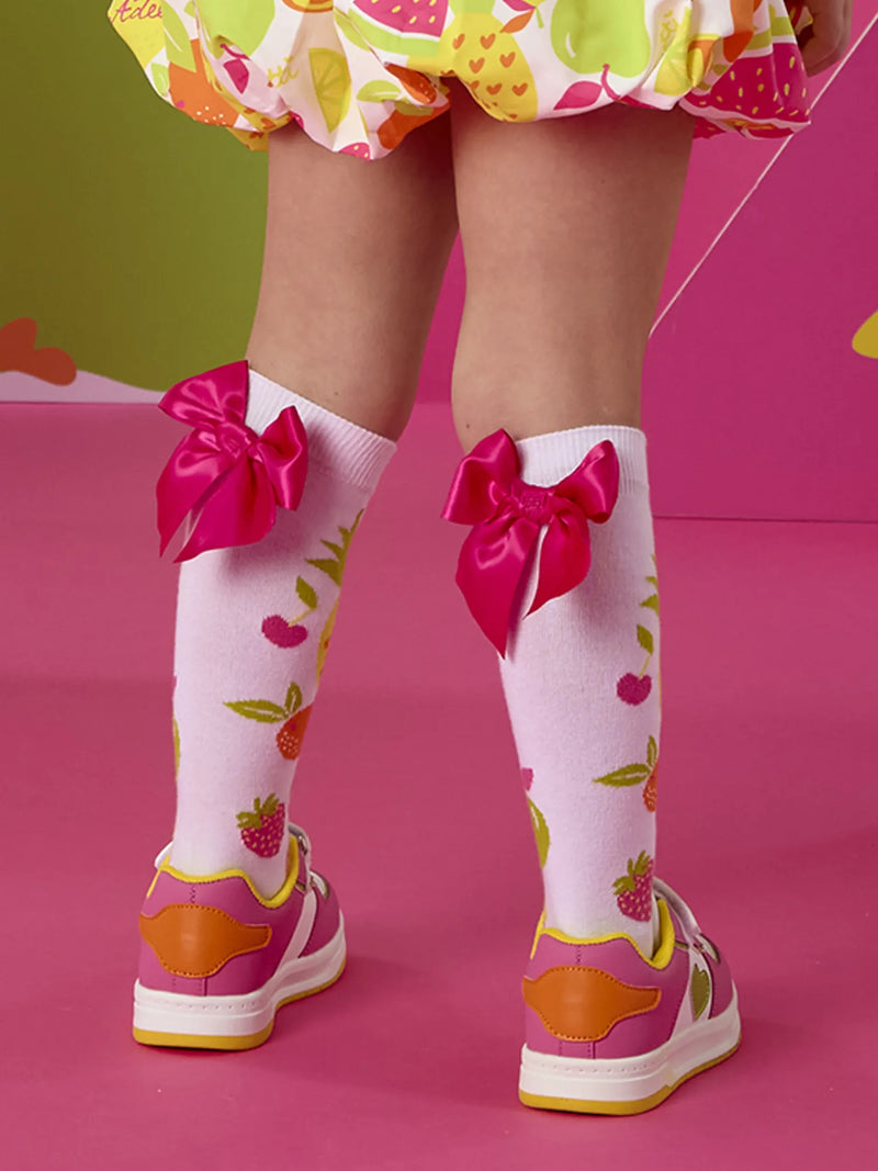 A Dee tammy knee socks with pink bows on the back.