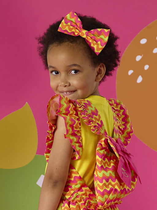 Girl wearing the A Dee tasha hair bow.