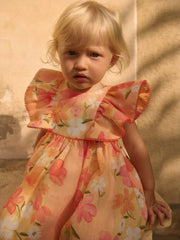Baby girl wearing the Abel and Lula floral dress.