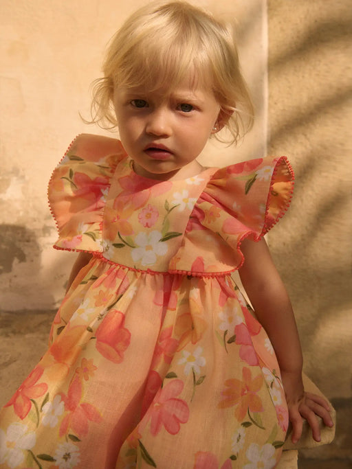 Baby girl wearing the Abel and Lula floral dress.