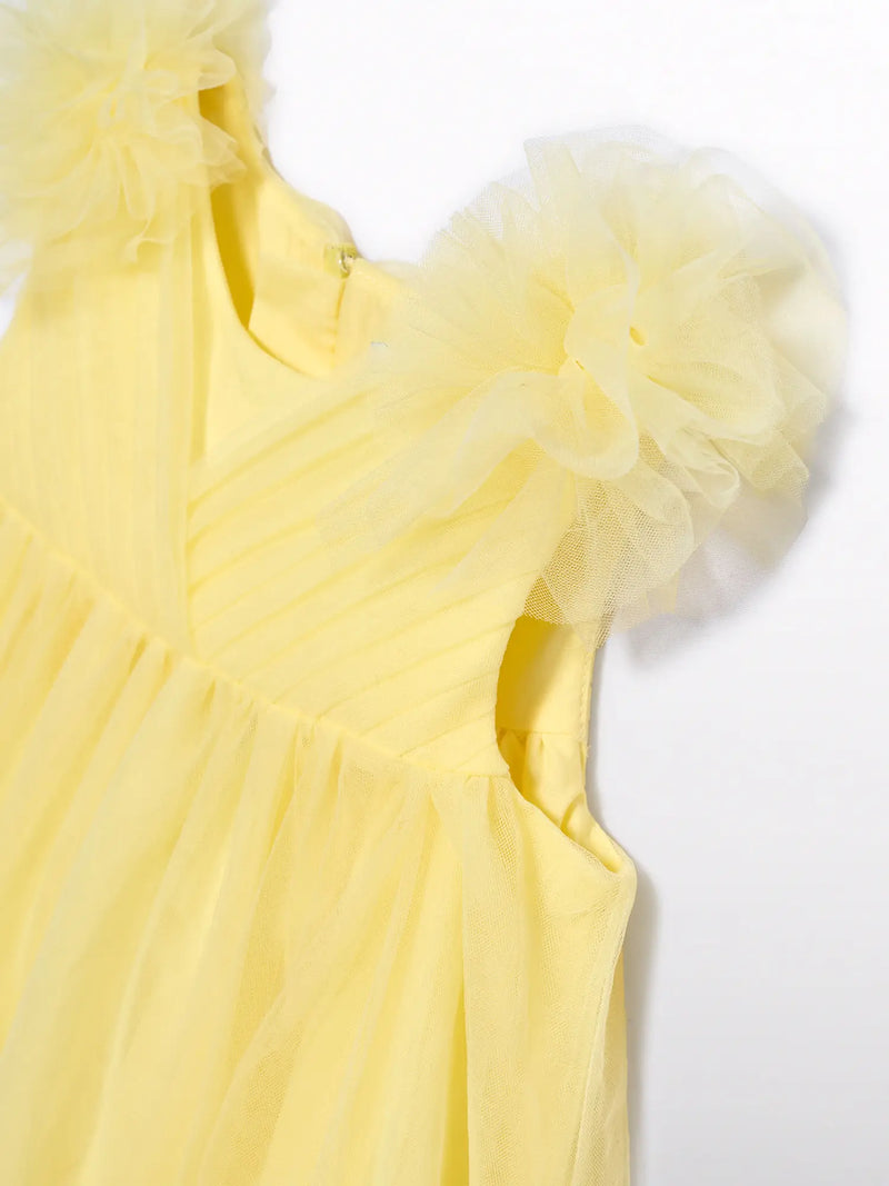 Closer look at the Abel and Lula tulle dress showing detail of the pleated bodice.