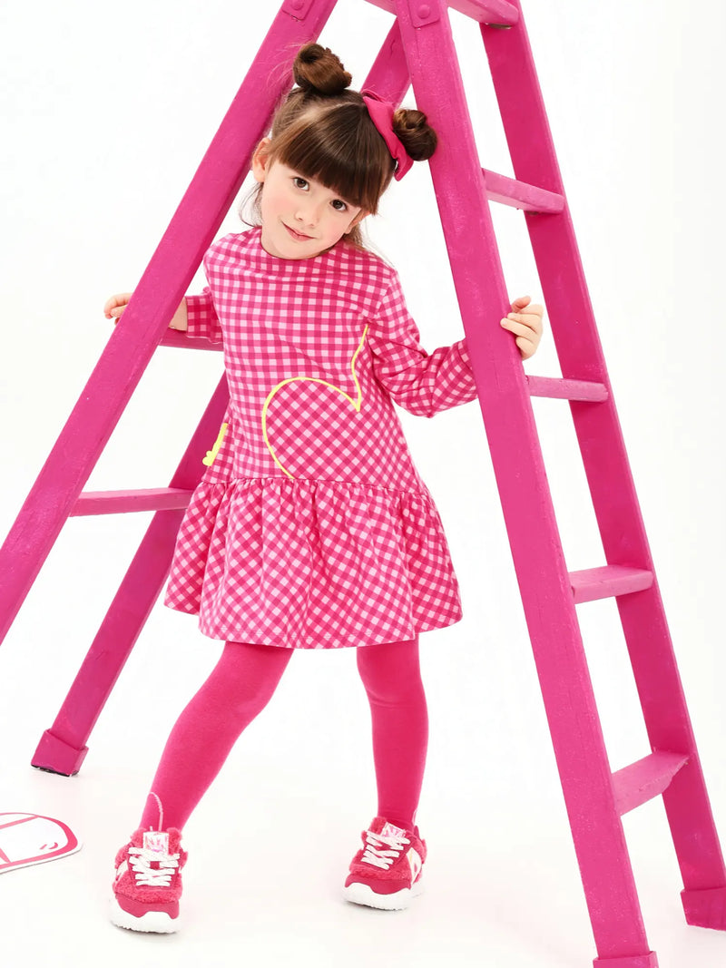 Girl modelling the Agatha Ruiz de la Prada gingham dress.