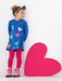 Smiling girl modelling the Agatha Ruiz de la Prada glitter dress.