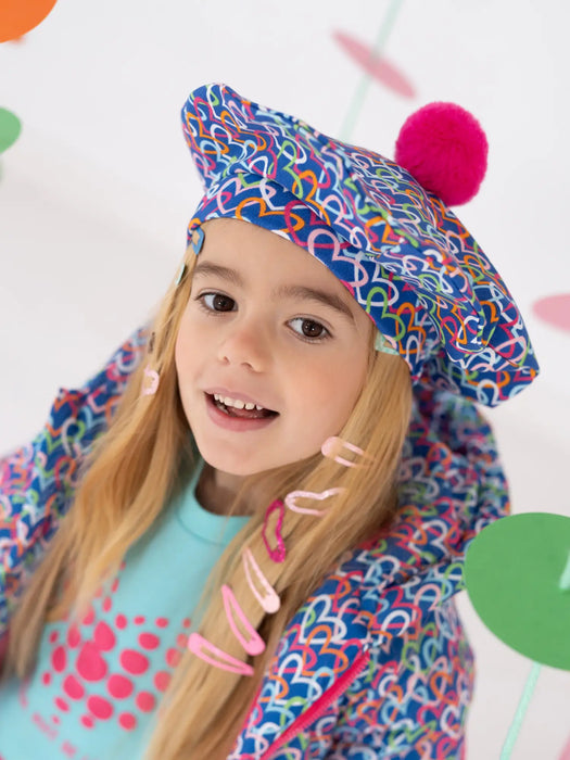 Girl modelling the Agatha Ruiz de la Prada hat & scarf.