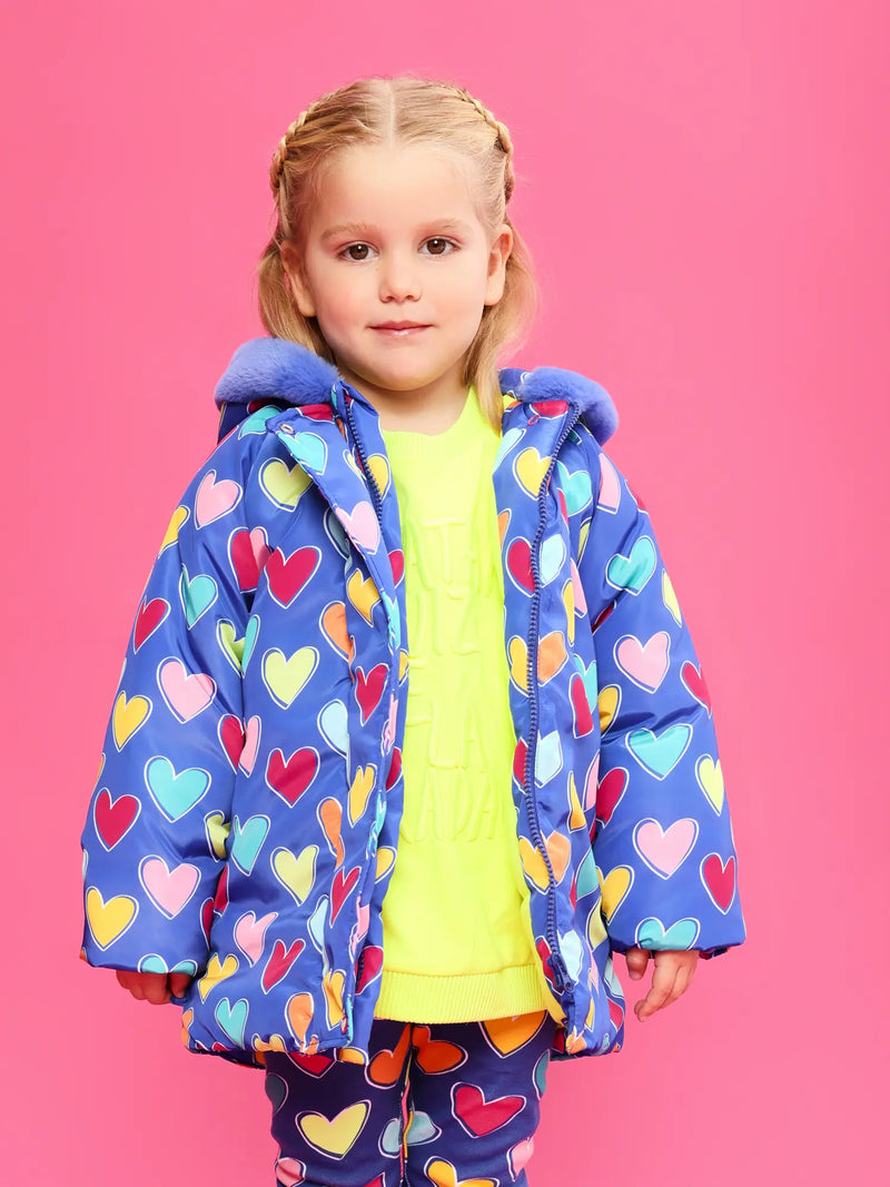 Girl wearing the Agatha Ruiz de la Prada heart print coat.