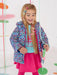 Smiling girl modelling the Agatha Ruiz de la Prada heart print coat.