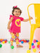 Smiling girl modelling the Agatha Ruiz de la Prada pansy leggings set.