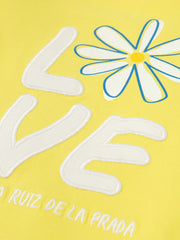 Agatha Ruiz de la Prada margarita dress with embroidered 'love' motif.