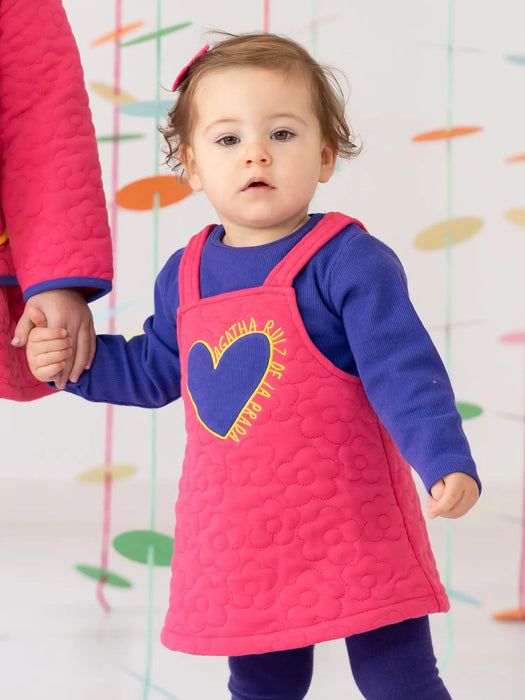 Girl wearing the Agatha Ruiz de la Prada quilted dress.