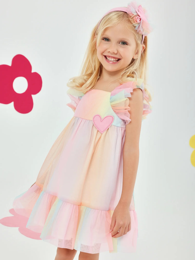 Smiling Girl modelling the Agatha Ruiz de la Prada tulle dress.