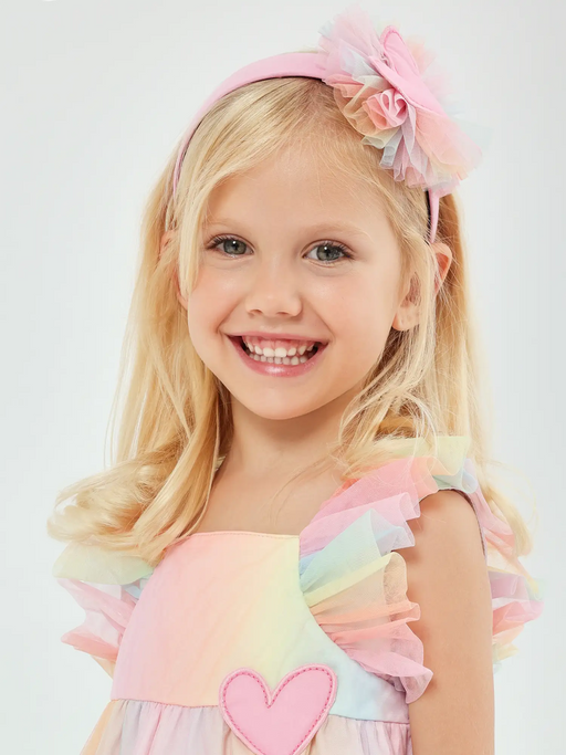 Girl modelling the Agatha Ruiz de la Prada tulle headband.