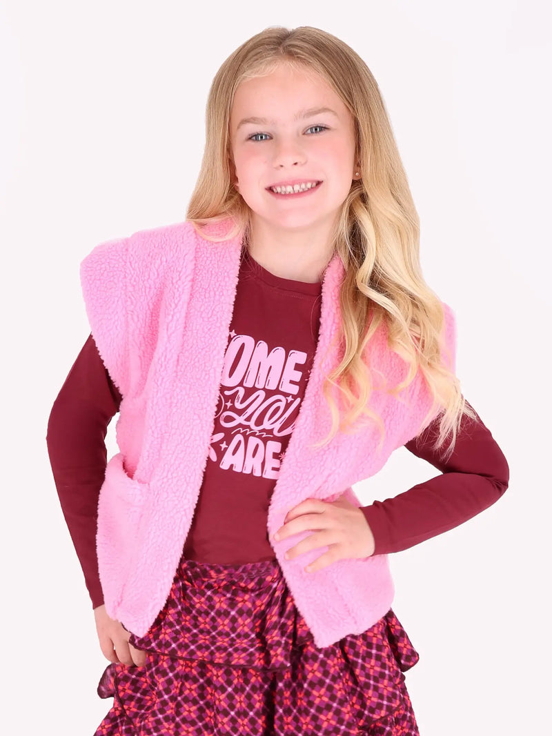 Smiling Girl modelling the B.Nosy george sherpa gilet.